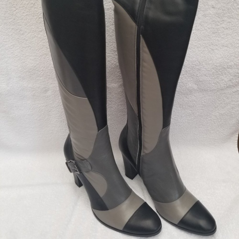 All  new and unworn tall boots in grey and black leather.